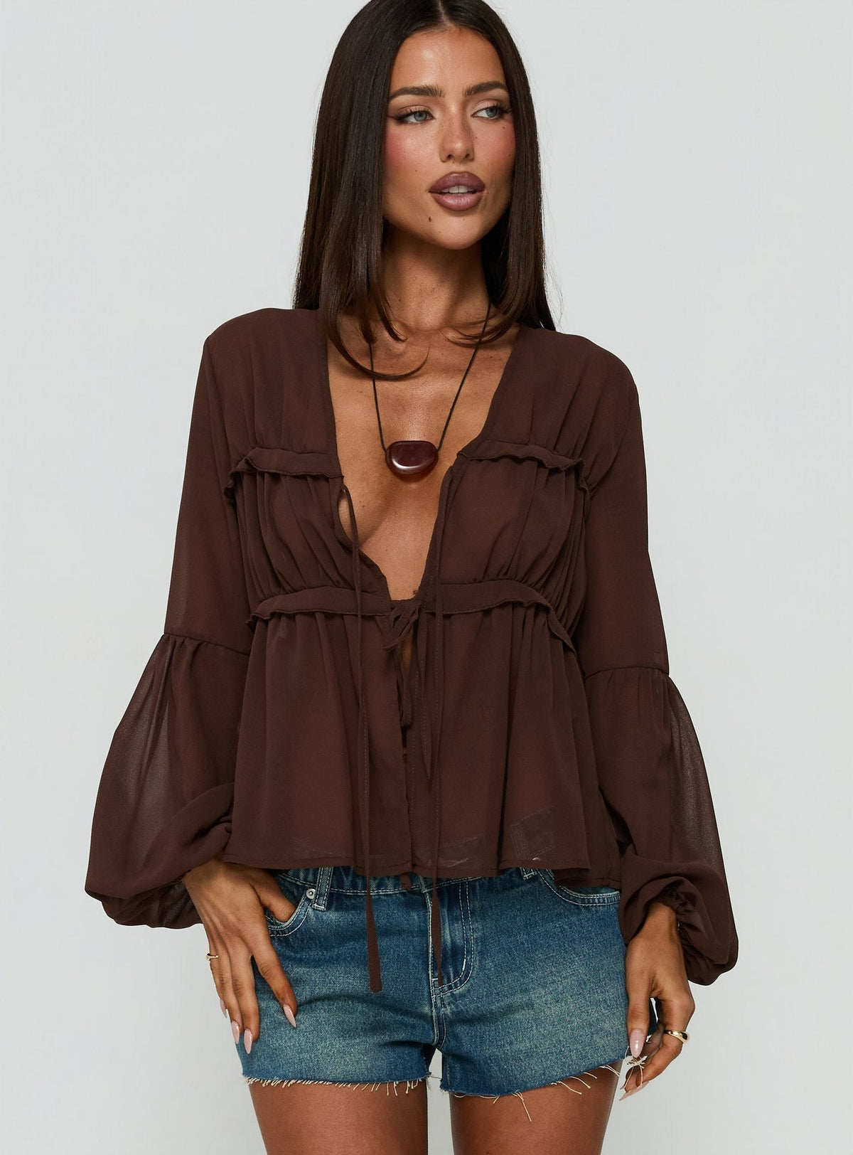 #NOVERA - Top Grazalema Chocolate Transparente de Manga Larga -