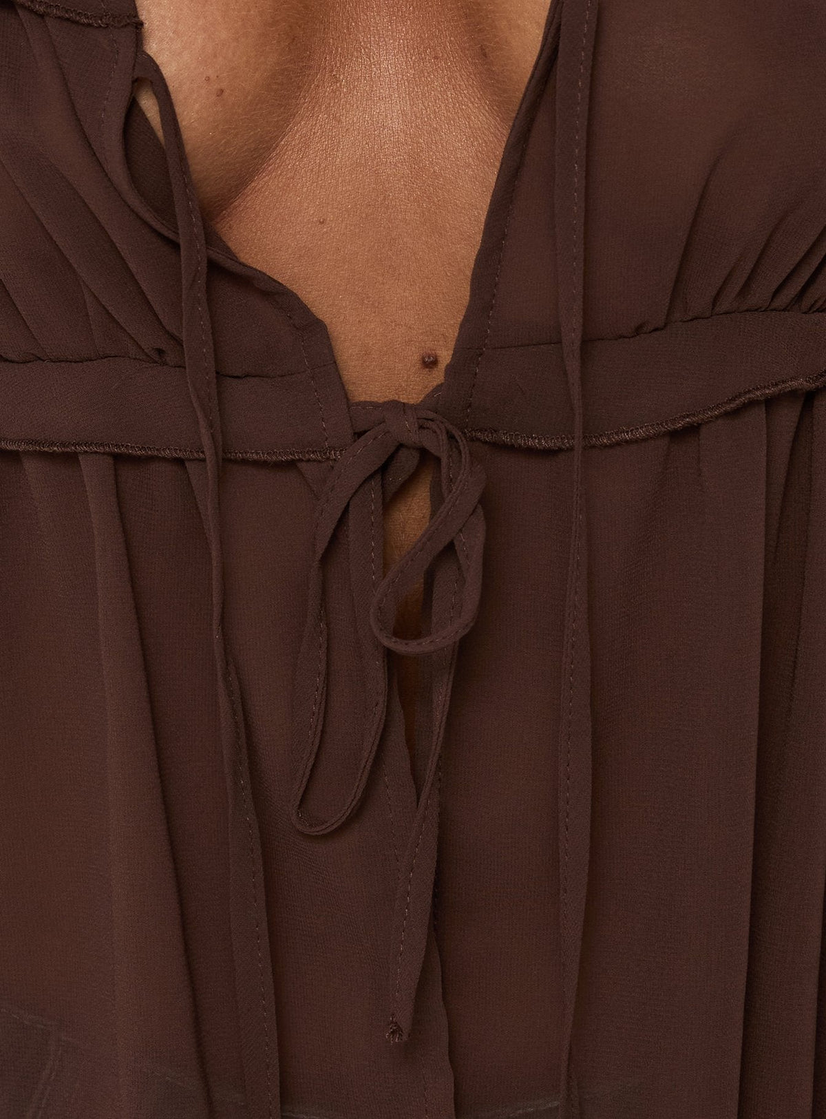 #NOVERA - Top Grazalema Chocolate Transparente de Manga Larga -
