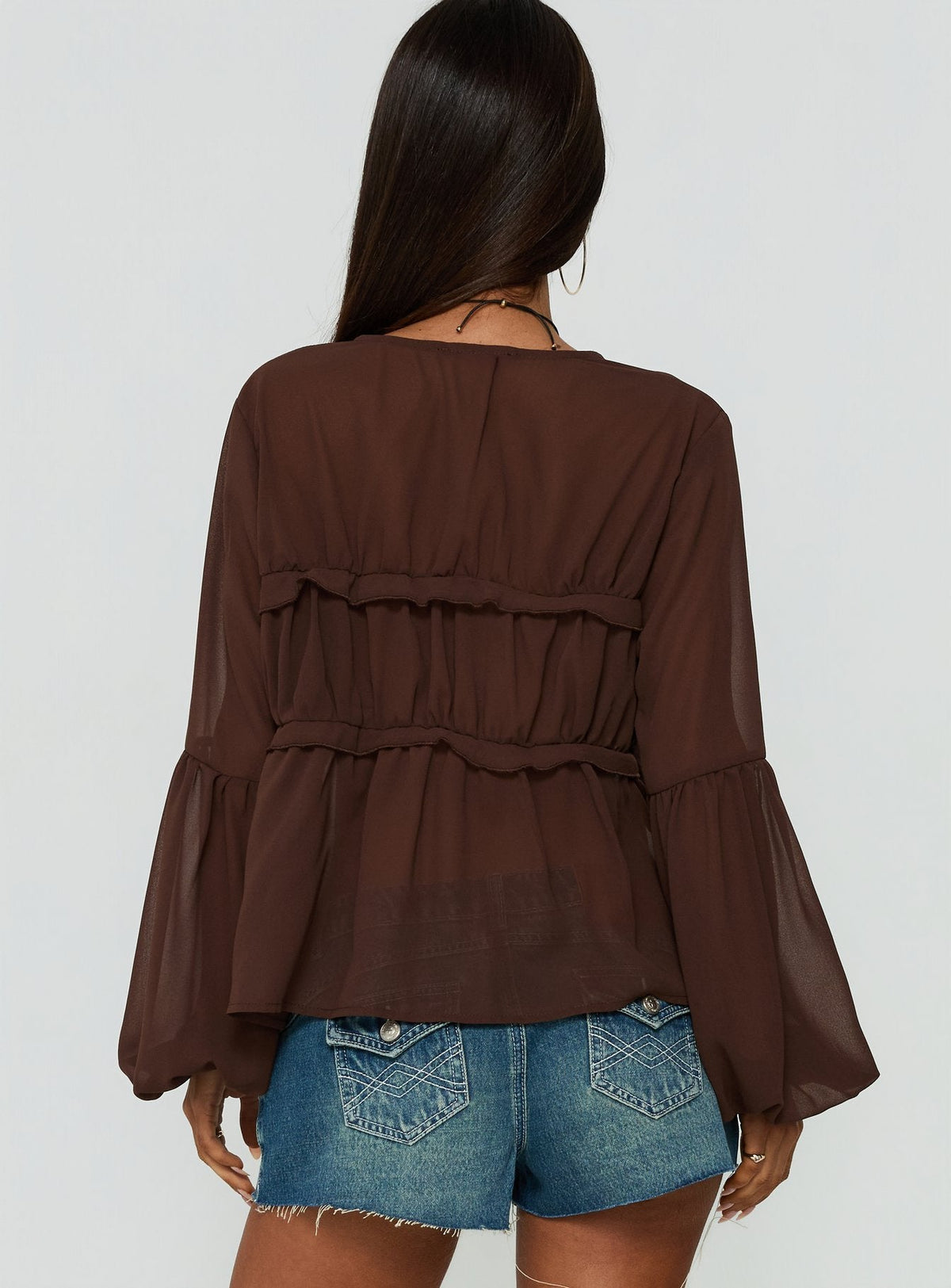 #NOVERA - Top Grazalema Chocolate Transparente de Manga Larga -